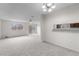 Spacious living room with new carpet, natural light, and backyard view at 2285 Coronado Pkwy # D, Denver, CO 80229
