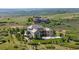Aerial view of the home showcasing its size, backyard, trees, and surrounding landscape at 7615 Lemon Gulch Way, Castle Rock, CO 80108