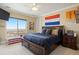 Comfortable bedroom with scenic views, a window bench, and a cozy layout for a relaxing retreat at 7615 Lemon Gulch Way, Castle Rock, CO 80108