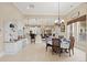 Bright dining area open to the kitchen, with a view to the outdoor patio at 7615 Lemon Gulch Way, Castle Rock, CO 80108