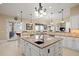 Spacious kitchen with center island, granite countertops, and stainless steel appliances at 7615 Lemon Gulch Way, Castle Rock, CO 80108