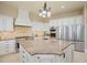Gourmet kitchen with a large center island and stainless steel appliances at 7615 Lemon Gulch Way, Castle Rock, CO 80108
