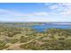 Expansive lake view surrounded by rolling hills and prairie at 7615 Lemon Gulch Way, Castle Rock, CO 80108