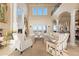 Elegant living room featuring high ceilings and a cozy fireplace at 7615 Lemon Gulch Way, Castle Rock, CO 80108