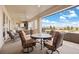 Inviting covered patio with comfortable seating and scenic views of the surrounding landscape at 7615 Lemon Gulch Way, Castle Rock, CO 80108