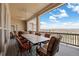 Covered patio with ample seating, perfect for outdoor dining and enjoying the panoramic views of the landscape at 7615 Lemon Gulch Way, Castle Rock, CO 80108