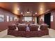 Home theater room featuring comfortable seating, a large screen, and a projector for an immersive viewing experience at 7615 Lemon Gulch Way, Castle Rock, CO 80108