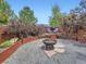 Relaxing backyard area with fire pit, lounge seating, and privacy fencing at 13244 Kearney St, Thornton, CO 80602
