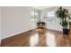 Open living room with hardwood floors and ample natural light streaming through the windows at 13244 Kearney St, Thornton, CO 80602