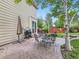 Inviting outdoor patio with dining area, grill, and a view of the landscaped backyard at 13244 Kearney St, Thornton, CO 80602