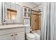 Well-maintained bathroom with updated fixtures, vanity, and tiled shower/tub at 2145 S Lewiston St, Aurora, CO 80013