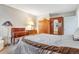 Bright and airy bedroom with wood paneling and ample closet and drawer space at 2145 S Lewiston St, Aurora, CO 80013