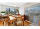 Cozy dining room featuring hardwood floors, a ceiling fan, and a sliding glass door at 2145 S Lewiston St, Aurora, CO 80013
