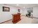 Finished basement with built-in bar and adjacent office area with natural light from egress window at 5753 S Kittredge St, Centennial, CO 80015