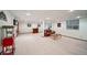 Finished basement featuring neutral carpet, a bar, and comfortable seating area perfect for entertaining at 5753 S Kittredge St, Centennial, CO 80015