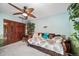 Bedroom featuring a daybed, ceiling fan, and closet at 5753 S Kittredge St, Centennial, CO 80015