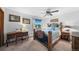 Bedroom with a uniquely decorated bed frame, desk, and ceiling fan at 5753 S Kittredge St, Centennial, CO 80015