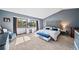 Main bedroom featuring a vaulted ceiling, ensuite, and decoratively appointed furnishings at 5753 S Kittredge St, Centennial, CO 80015