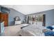 Main bedroom with a vaulted ceiling, natural light, soft carpet, and decoratively appointed furnishings at 5753 S Kittredge St, Centennial, CO 80015