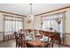 Dining room featuring a chandelier, formal table setting, and an antique buffet cabinet at 5753 S Kittredge St, Centennial, CO 80015