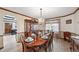 Formal dining room featuring a chandelier, neutral color scheme, and views of the property at 5753 S Kittredge St, Centennial, CO 80015