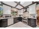 Well-appointed kitchen with stainless steel appliances, dark granite countertops, and plenty of cabinet space at 5753 S Kittredge St, Centennial, CO 80015