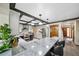 Updated kitchen with breakfast bar seating, stainless steel appliances, and hardwood flooring at 5753 S Kittredge St, Centennial, CO 80015