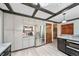 Updated kitchen with stainless steel refrigerator, hardwood floors, and ample storage at 5753 S Kittredge St, Centennial, CO 80015