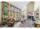 Bright living room featuring high ceilings, large windows, and an open view to the kitchen at 5753 S Kittredge St, Centennial, CO 80015