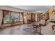 Bright living room featuring a large window, hardwood floors, and a classic sitting area at 5753 S Kittredge St, Centennial, CO 80015