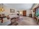 Spacious living room showcasing hardwood floors, elegant furnishings, and neutral color palette at 5753 S Kittredge St, Centennial, CO 80015