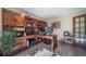 Inviting home office featuring custom built-ins, a spacious desk, and natural light at 5753 S Kittredge St, Centennial, CO 80015