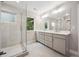 Modern bathroom featuring a glass shower and dual vanity sinks at 779 Kohlor Dr, Lafayette, CO 80026