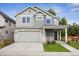 Charming two-story home with stone accents, attached two car garage, and well maintained lawn at 779 Kohlor Dr, Lafayette, CO 80026