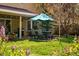 Cozy patio with dining set and barbecue grill, perfect for outdoor entertaining in a lush yard at 6219 S Krameria St, Centennial, CO 80111