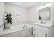 Bright bathroom features a soaking tub, tiled walls, and vanity at 6219 S Krameria St, Centennial, CO 80111