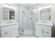 Modern bathroom featuring a glass-enclosed shower and double vanity sinks at 6219 S Krameria St, Centennial, CO 80111