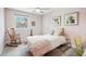 Cozy bedroom with rocking chair, guitar and large sunlit window at 6219 S Krameria St, Centennial, CO 80111