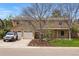 Charming two-story home featuring a well-manicured front yard, two-car garage, and beautiful mature trees at 6219 S Krameria St, Centennial, CO 80111