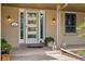 Inviting front door with decorative glass and sidelights, accented by outdoor lighting and a cozy porch at 6219 S Krameria St, Centennial, CO 80111