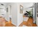 Hallway view of the piano room, showing hardwood floors and neutral paint at 6219 S Krameria St, Centennial, CO 80111