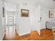 Entry hall featuring hardwood floors, white trim, and access to the living areas at 6219 S Krameria St, Centennial, CO 80111
