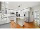 Spacious kitchen featuring white cabinetry, stainless steel appliances, and a center island with granite countertops at 6219 S Krameria St, Centennial, CO 80111