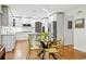 Bright kitchen area with stainless steel appliances, island seating, and an adjacent dining area at 6219 S Krameria St, Centennial, CO 80111