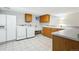 Laundry room with tile flooring, wooden cabinets, a sink, counter space and a washer and dryer set at 6219 S Krameria St, Centennial, CO 80111