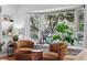Cozy seating area with a bay window that offers natural light and green views at 6219 S Krameria St, Centennial, CO 80111