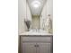 Classic powder room featuring white vanity, granite counters, mirror, and white walls at 6219 S Krameria St, Centennial, CO 80111