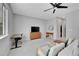Large bedroom featuring a ceiling fan, dual work stations, and comfortable seating at 6211 W 28Th Ct, Wheat Ridge, CO 80214