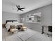Spacious bedroom with large window, ceiling fan, and modern minimalist decor offers a relaxing retreat at 6211 W 28Th Ct, Wheat Ridge, CO 80214