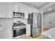 A kitchen equipped with stainless steel appliances and sleek, stylish finishes at 6211 W 28Th Ct, Wheat Ridge, CO 80214